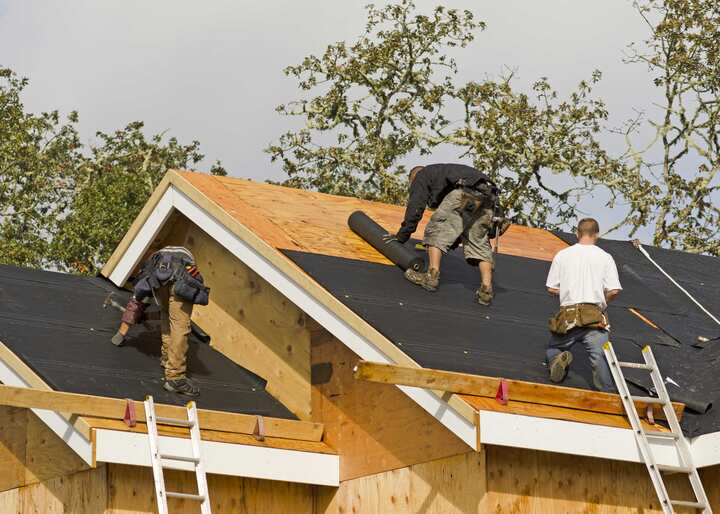 Roofing repair experts working on a residential home in Roseville, CA.